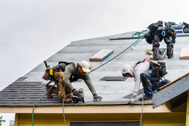 Professional Roofing technician working in Wadesville, IN